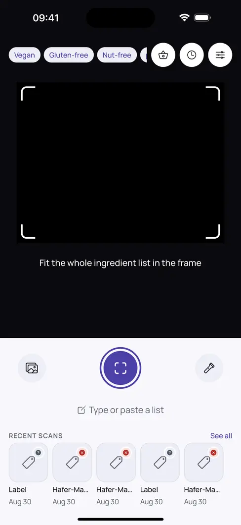 Bitewise home screen: your active checks as chips across the top — Vegan, Gluten-free, Nut-free — a viewfinder with a guide frame, a scan button, a “type or paste a list” option, and recent scans below.