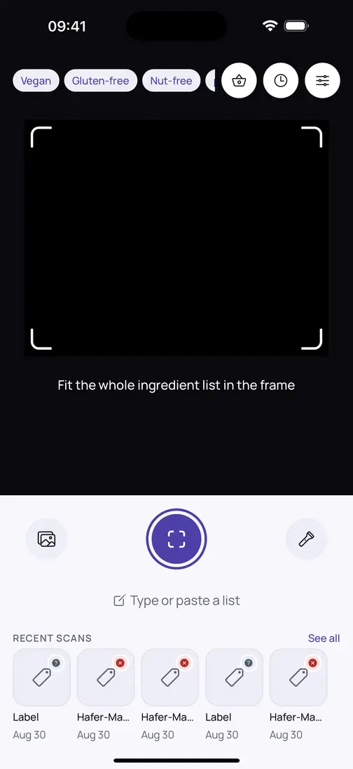 Bitewise home screen: your active checks as chips across the top — Vegan, Gluten-free, Nut-free — a viewfinder with a guide frame, a scan button, a “type or paste a list” option, and recent scans below.